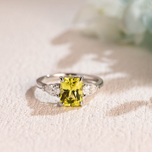 solid-gold-radiant-cut-pear-cut-three-stone-ring