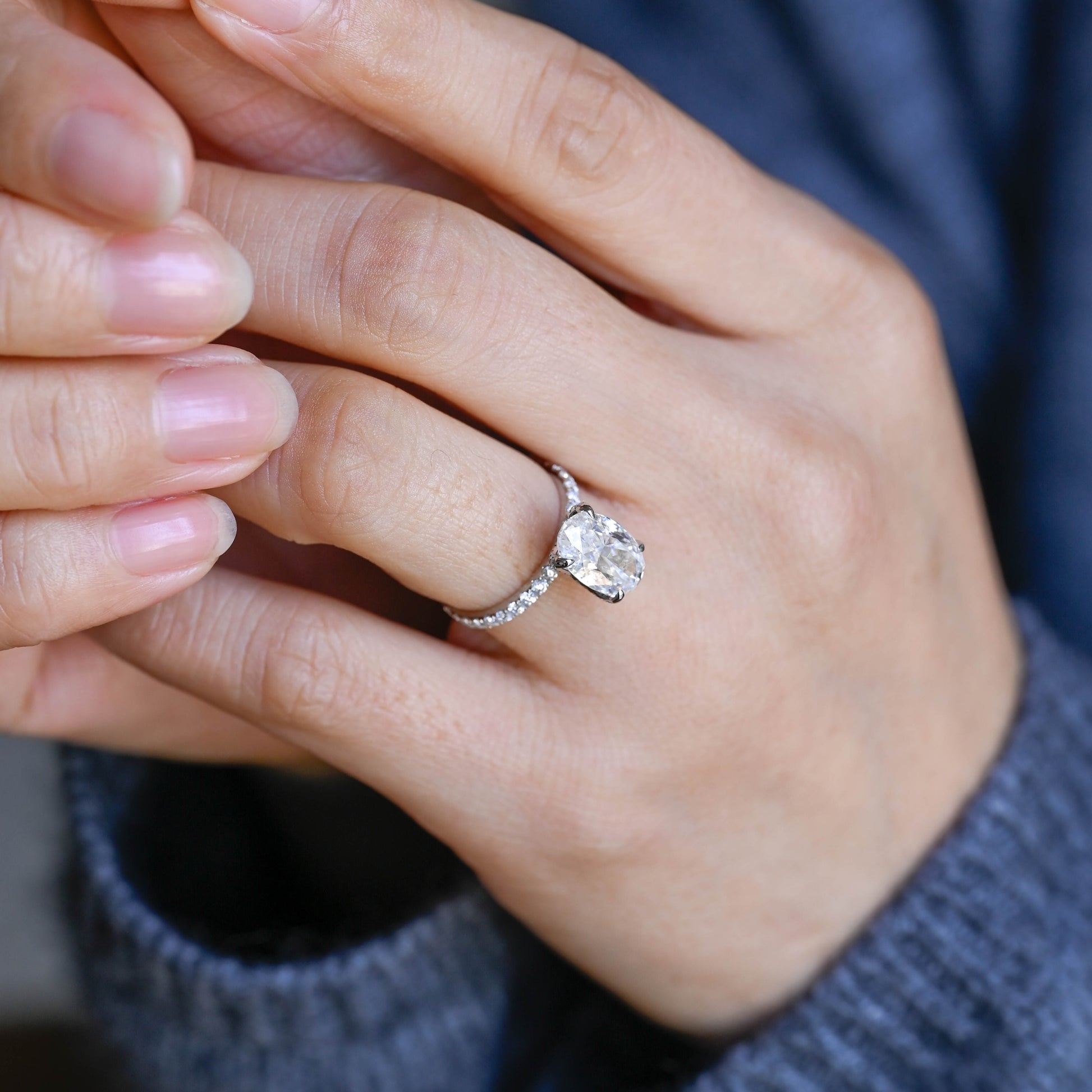 floral-inspired-oval-moissanite-engagement-ring-half-eternity-proposal-ring