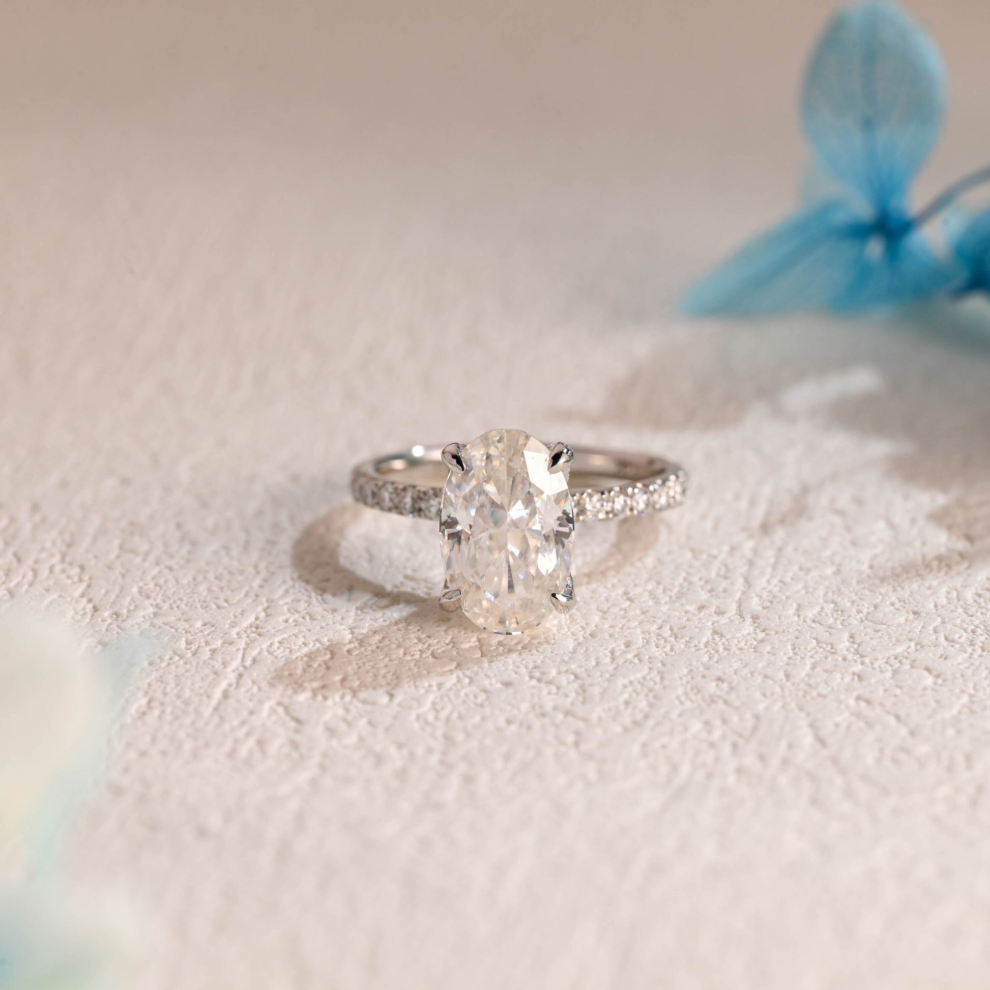 floral-inspired-oval-moissanite-engagement-ring-half-eternity-proposal-ring