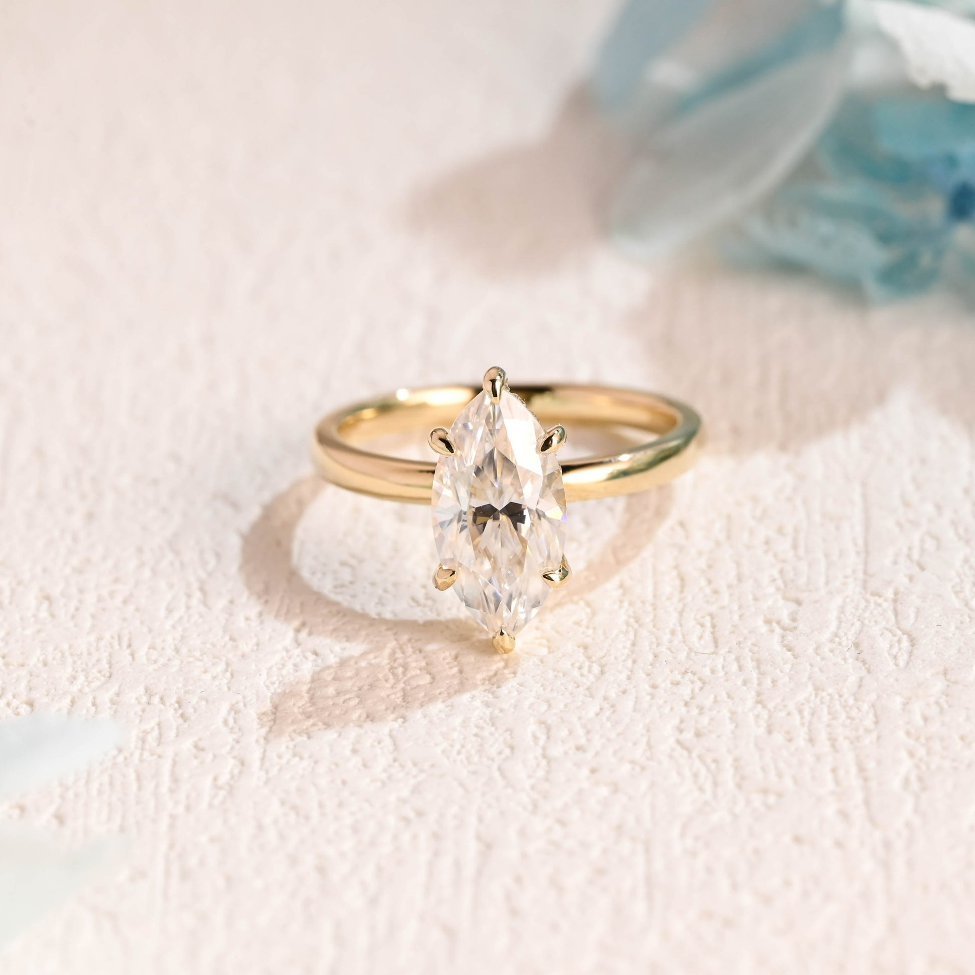 solid-gold-marquise-cut-moissanite-engagement-ring-hidden-halo