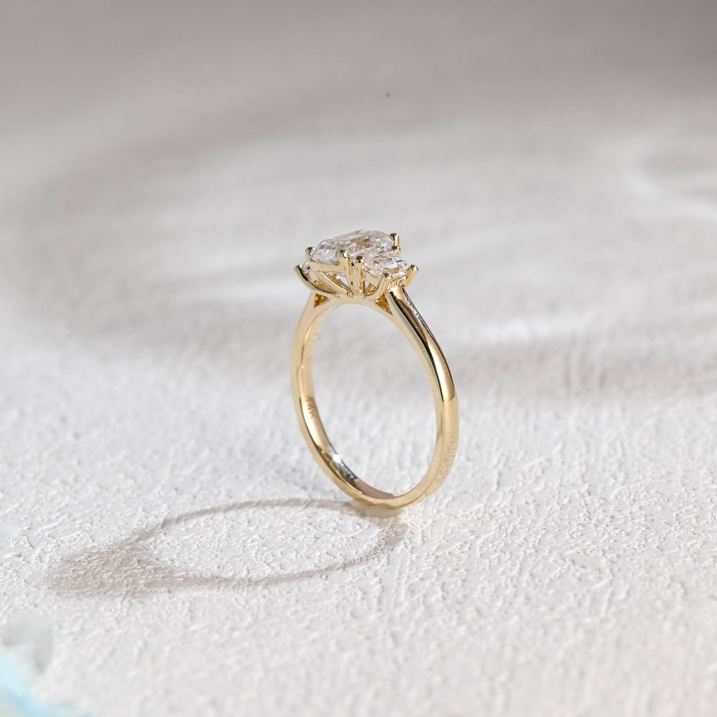 solid-gold-emerald-cut-moissanite-engagement-ring-three-stone-ring