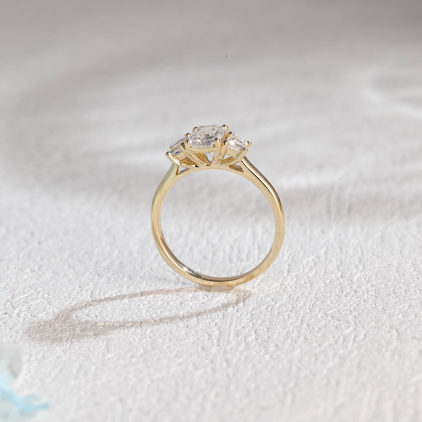 solid-gold-emerald-cut-moissanite-engagement-ring-three-stone-ring