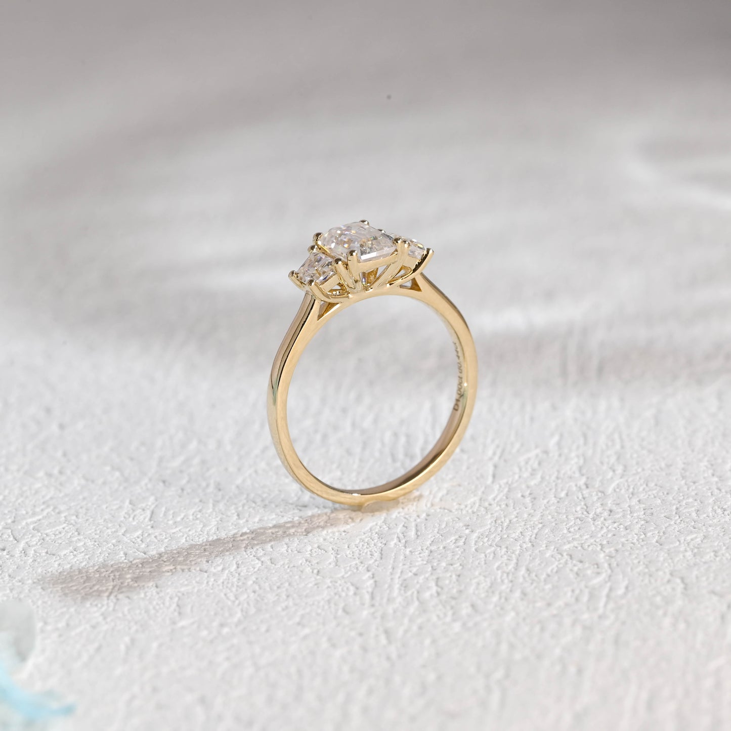 solid-gold-emerald-cut-moissanite-engagement-ring-three-stone-ring