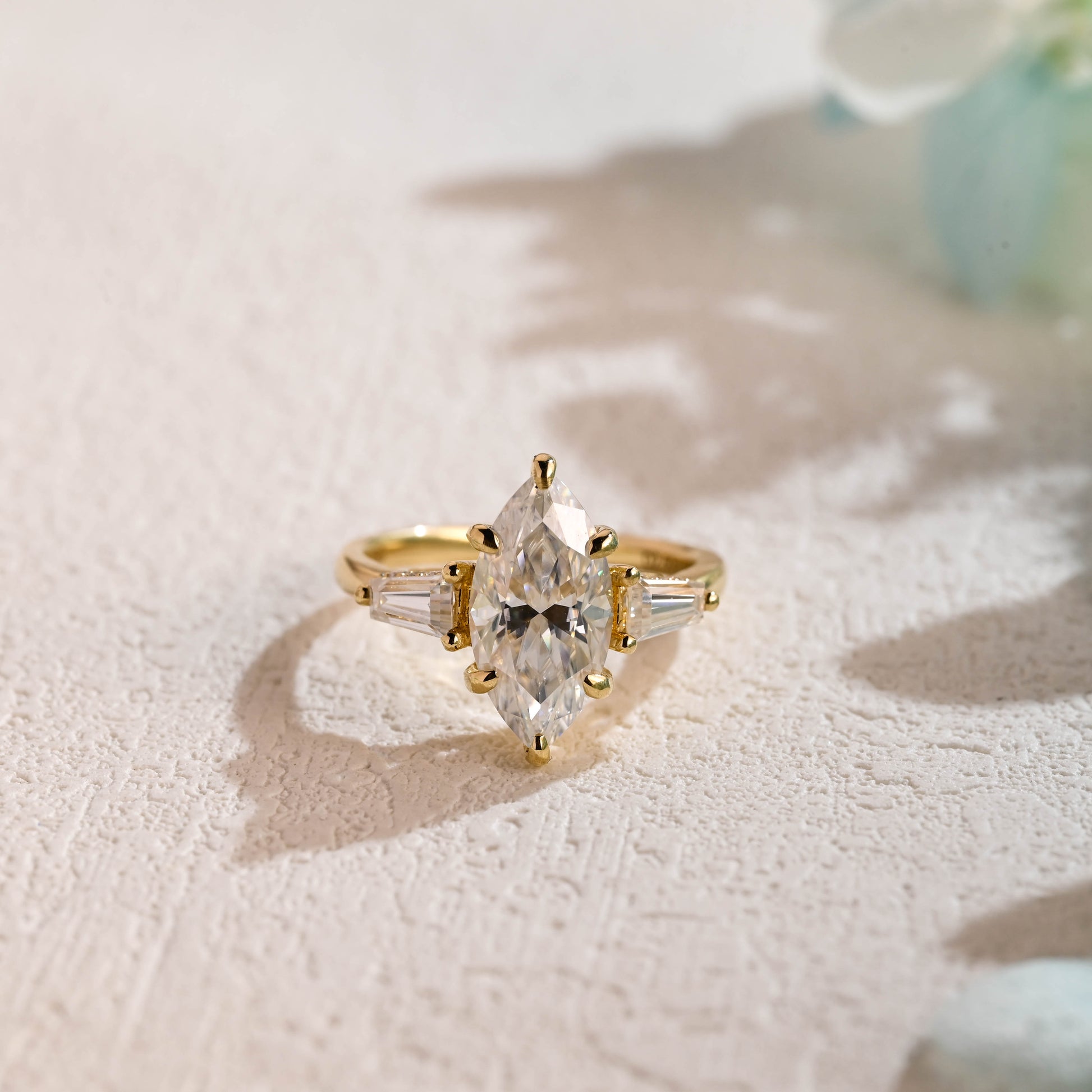 solid-gold-marquise-cut-moissanite-engagement-ring-three-stone-ring