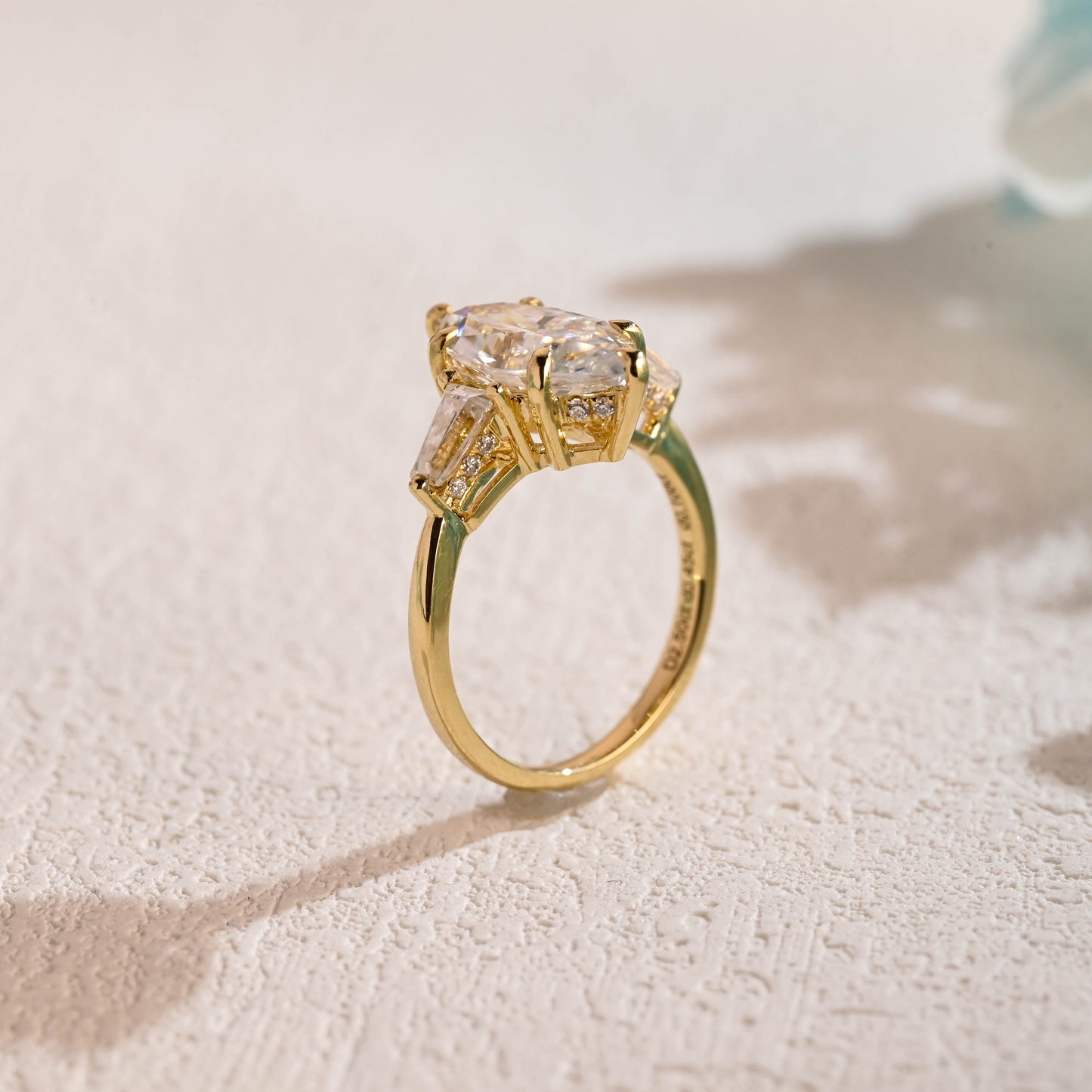 solid-gold-marquise-cut-moissanite-engagement-ring-three-stone-ring