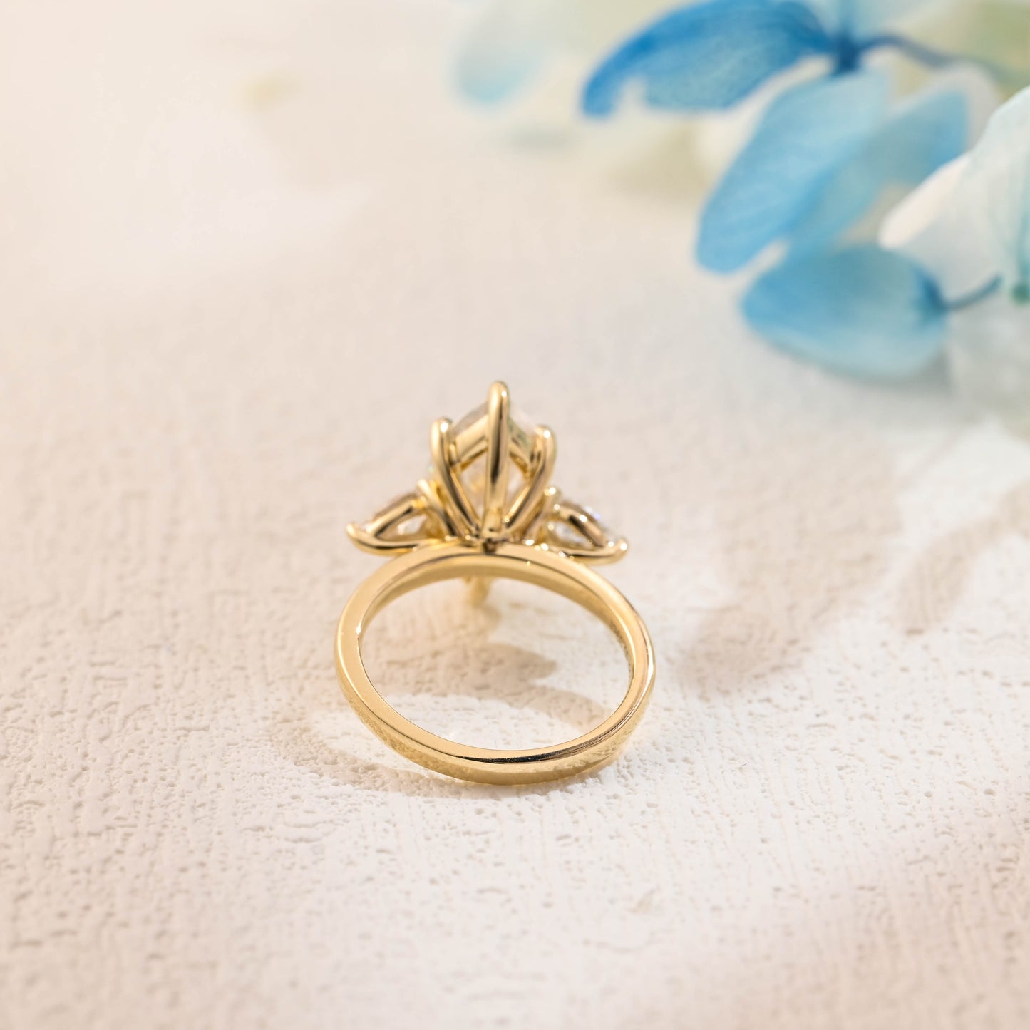 solid-gold-marquise-cut-three-stone-ring-pear-cut-ring