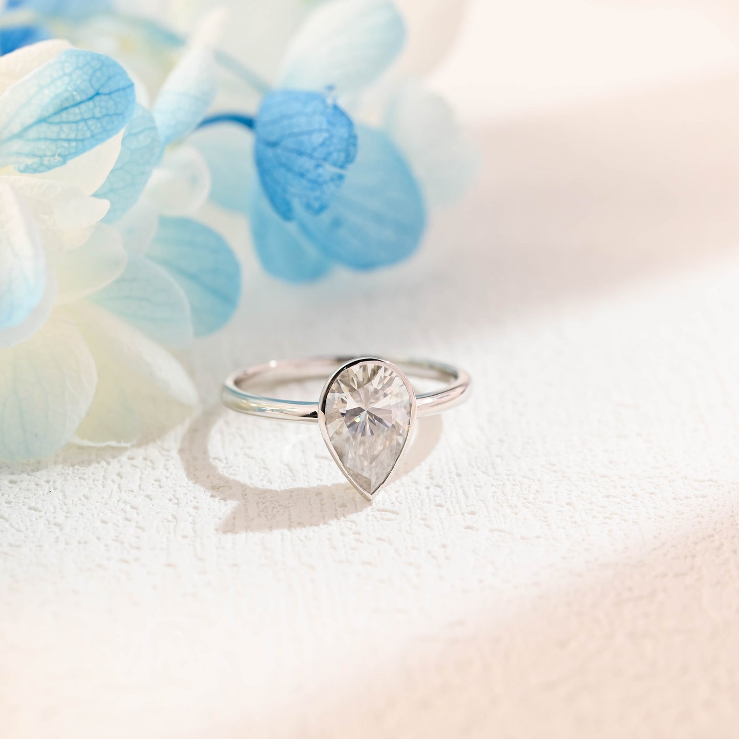 bezel-pear-cut-moissanite-ring