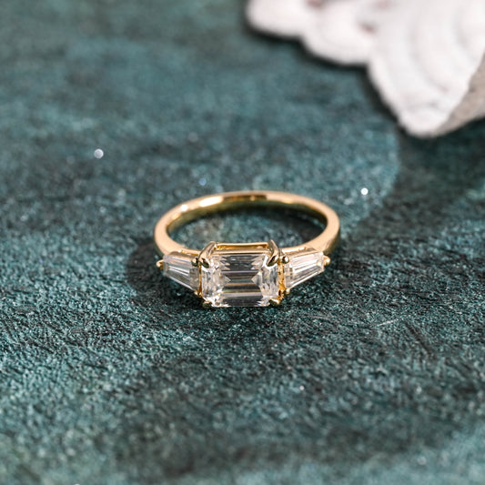 emerald-cut-lab-grown-diamond-ring-three-stone-wedding-ring