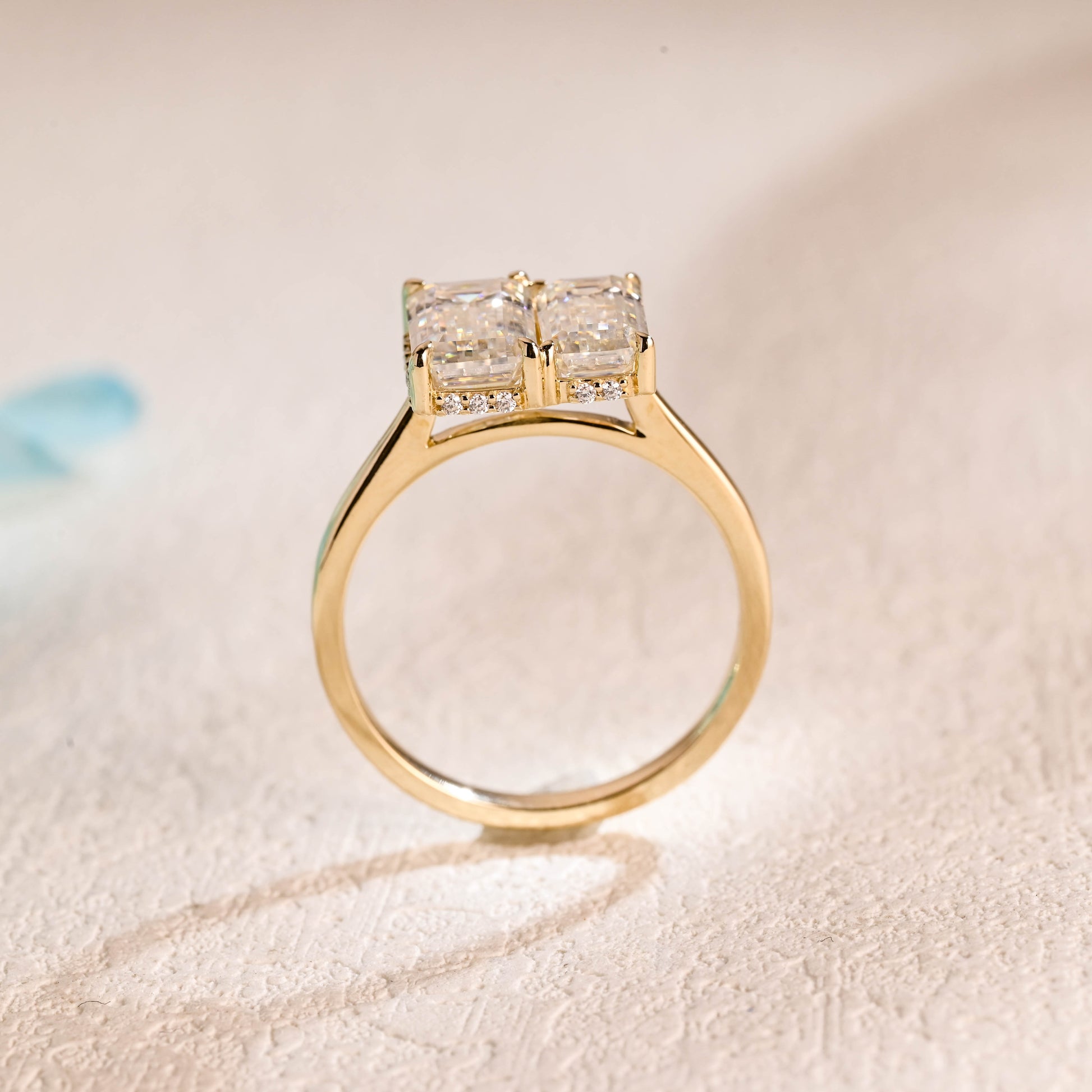 emerald-cut-moissanite-toi-et-moi-ring-elongated-wedding-ring