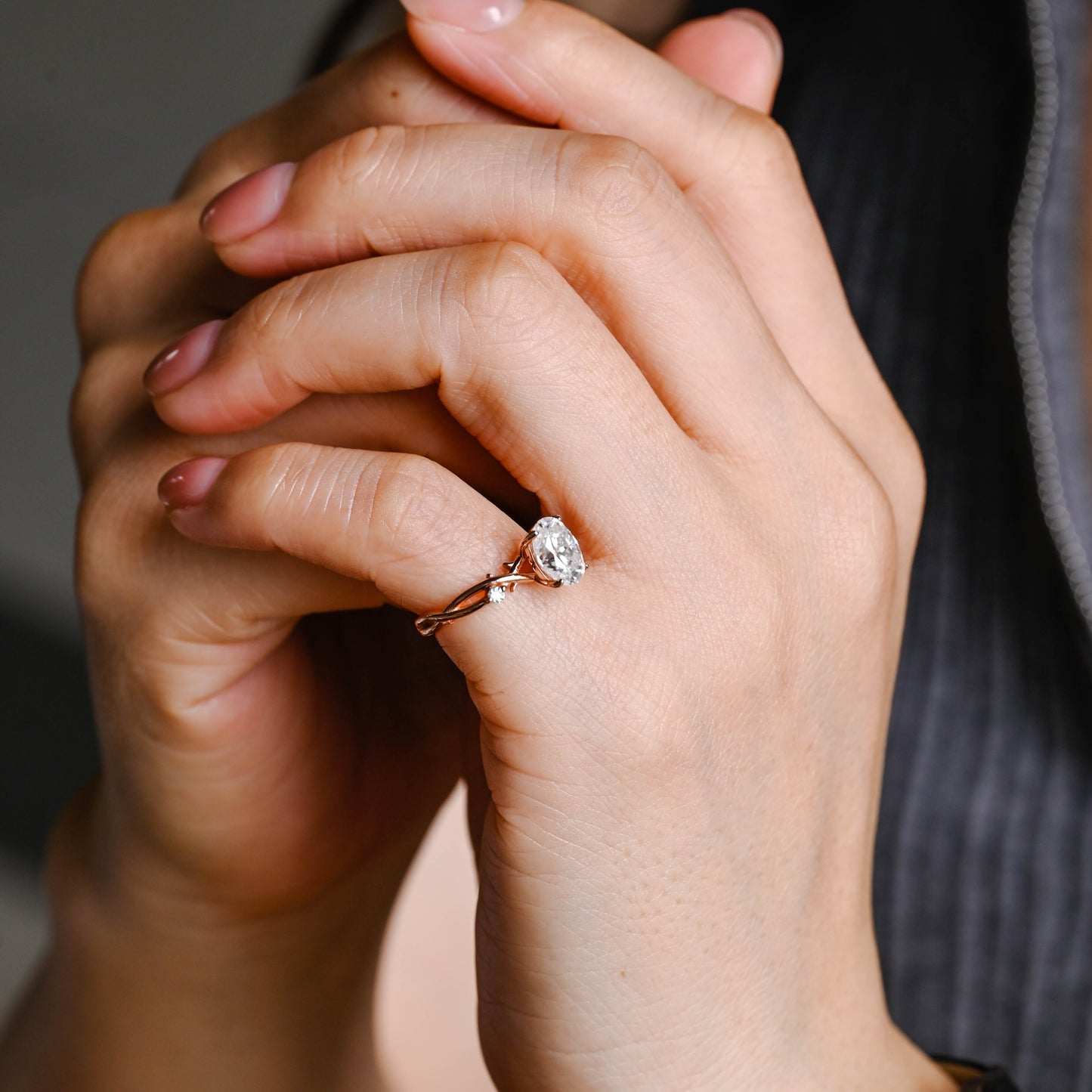 oval-cut-moissanite-ring-twist-band-leaf-ring