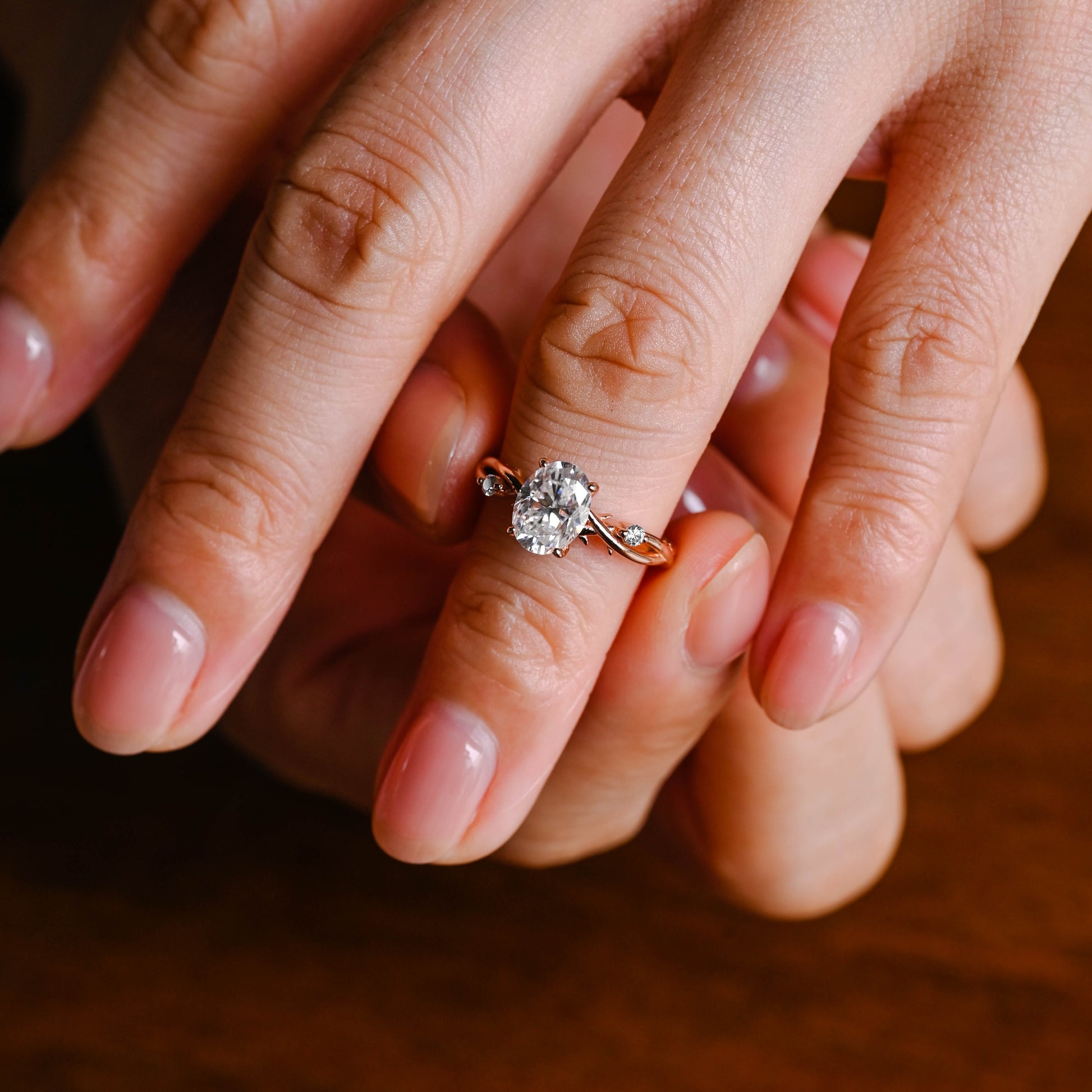 oval-cut-moissanite-ring-twist-band-leaf-ring