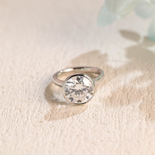 round-cut-moissanite-wedding-ring-bezel-set-engagement-ring