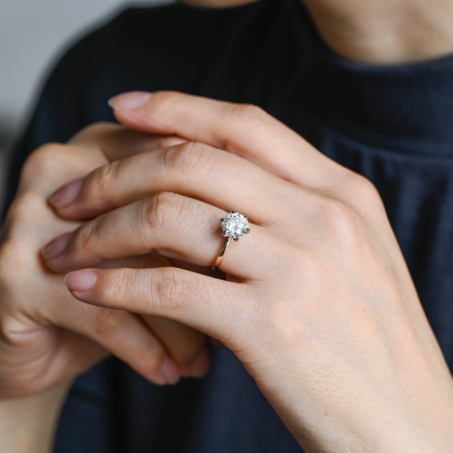 two-tone-round-cut-moissanite-engagement-ring