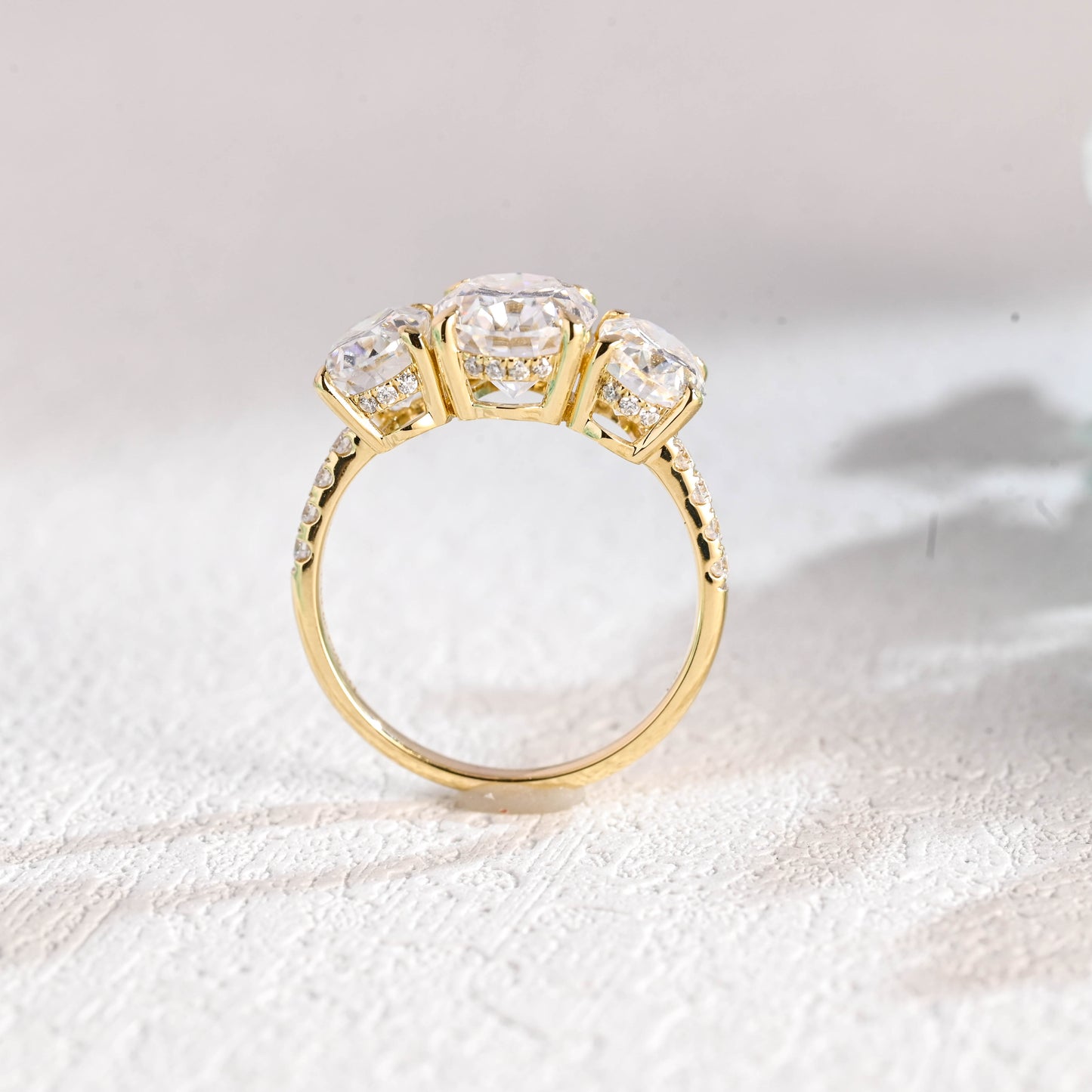 oval-cut-three-stone-engagement-ring-hidden-halo-half-pave-ring