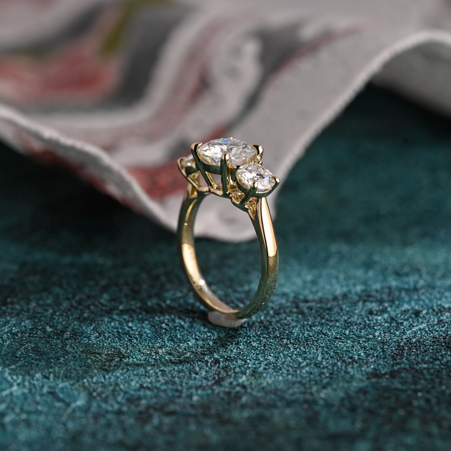 round-cut-lab-grown-diamond-ring-three-stone-engagement-ring